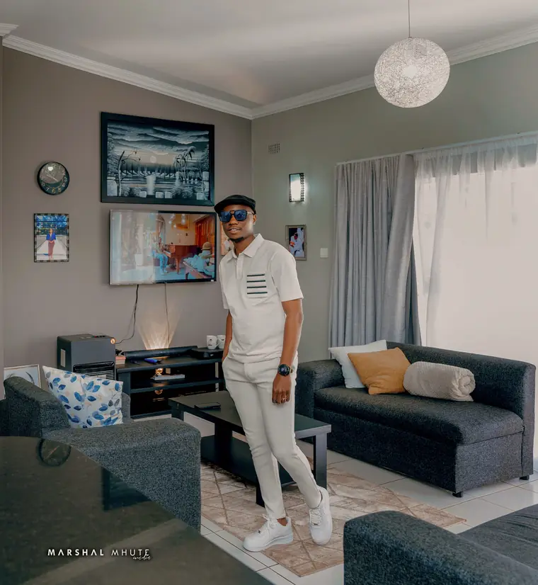 Wesley Mutsa Bangira, founder of Black Excellence, in white with a black cap and sunglasses